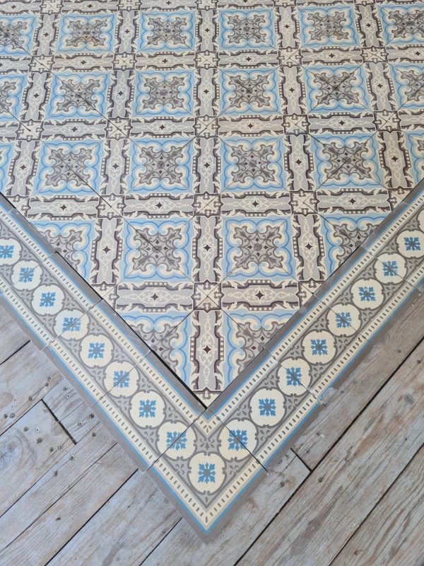 Reclaimed encaustic patterned tiles with matching border tiles