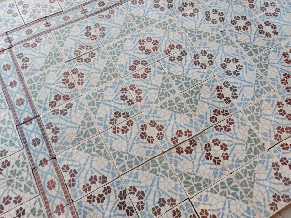 Antique reclaimed floor tiles with flower motif