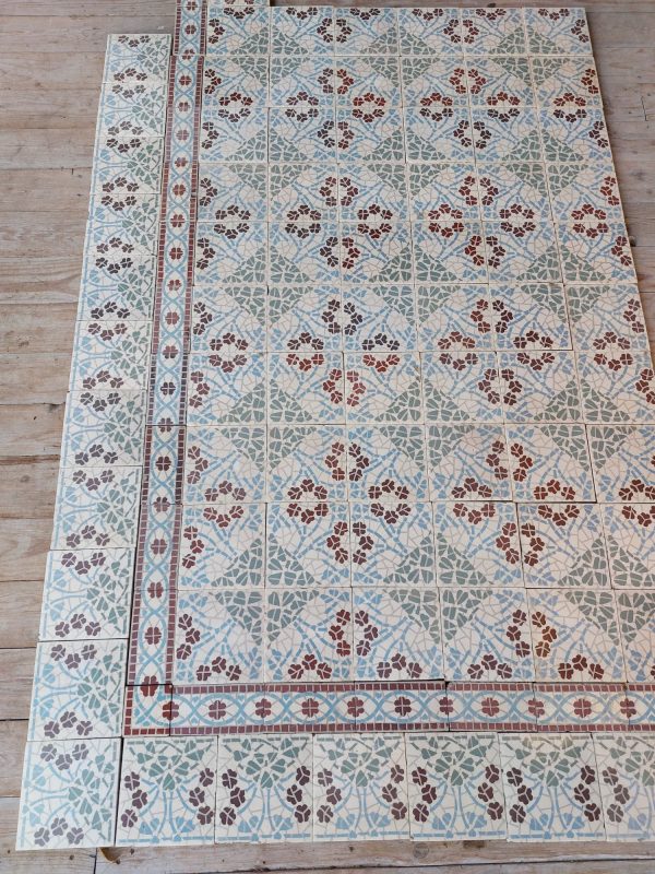 Antique mosaic tiles with flower pattern and two types of border tiles