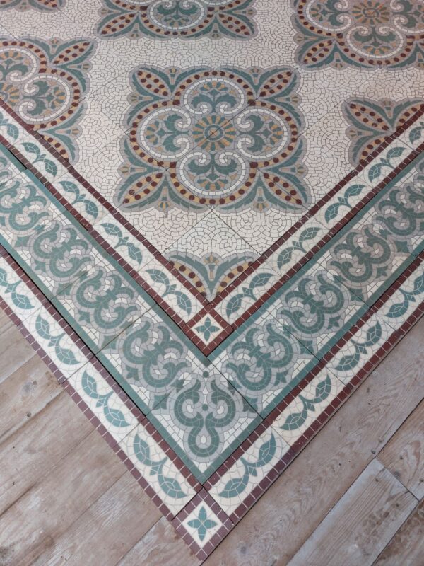 Antique ceramic floor with triple border and 16 - tile flower motif