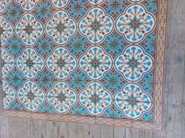 Reclaimed tiles with 4 tile flower pattern and matching border tiles