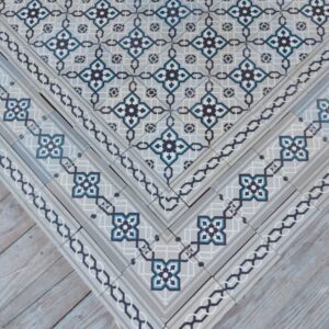 Antique encaustic tiles in shades of grey and a touch of blue