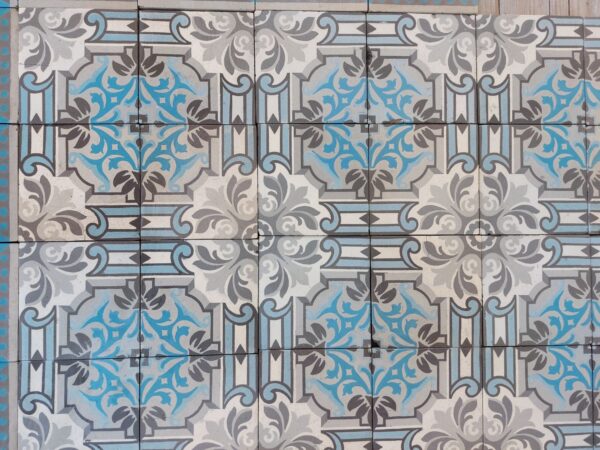 Antique ceramic patterned tiles in blue and grey