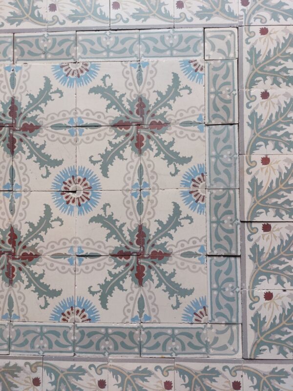 Reclaimed tiles with a pattern of cornflowers and thistles