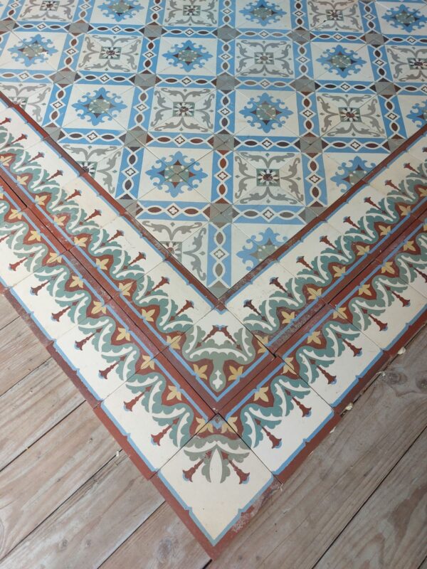 Antique encaustic reclaimed floor with double border