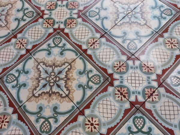 Old ceramic tiles with flower pattern in Art-Nouveau style