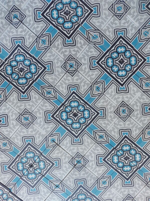Reclaimed encaustic tiles in shades of grey and blue