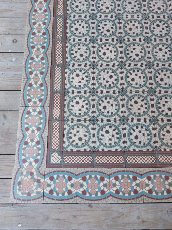 Antique encaustic floor tiles with double border