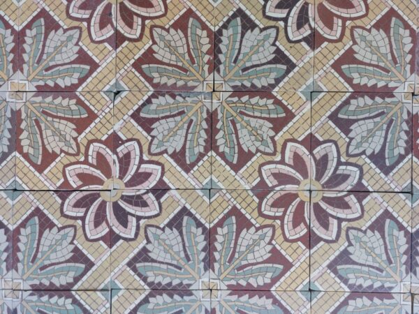 Reclaimed patterned tiles with flower pattern with a touch of pink, yellow and green