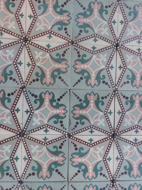Patterned tiles with star motif in shades of pink and green