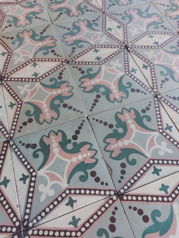 Reclaimed tiles with star pattern in shades of pink and green