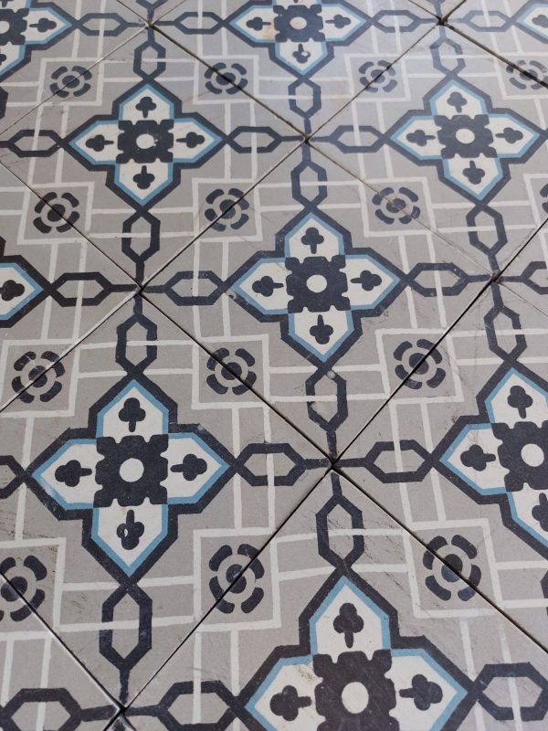 Antique encaustic patterned tiles with a classical design