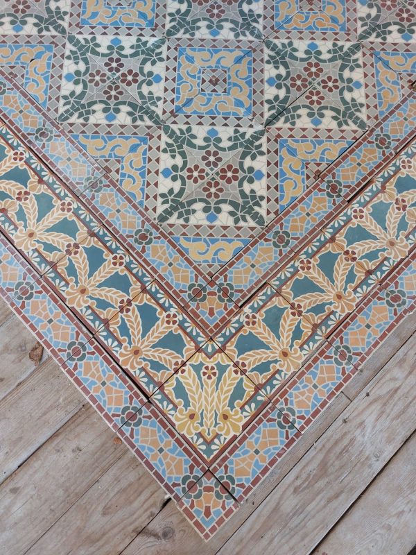 Reclaimed antique encaustic tiles with mosaic thema and vegetatif pattern and original double border