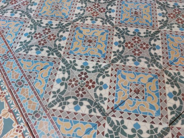 Reclaimed antique encaustic tiles with mosaic thema and flower pattern