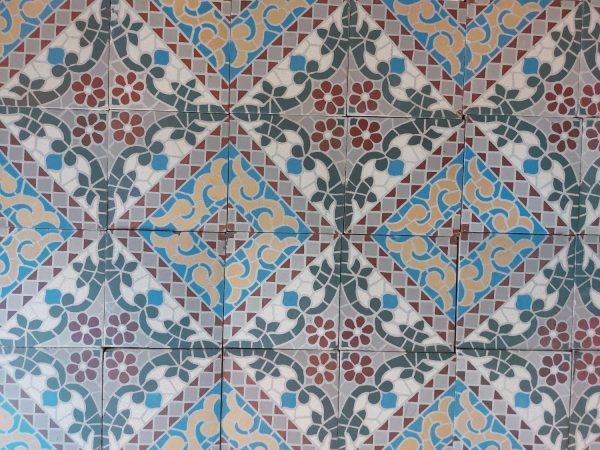 Reclaimed antique encaustic tiles with mosaic thema and flower pattern