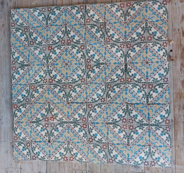 Reclaimed antique encaustic tiles with mosaic thema and flower motif and original double border