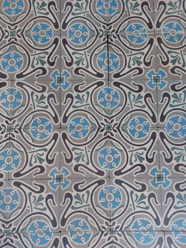Reclaimed encaustic tiles with dominant colors blue and grey ca 1909