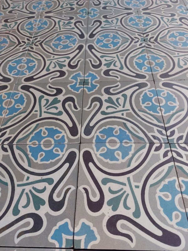 Reclaimed encaustic Art-Nouveau tiles with dominant colors blue and grey