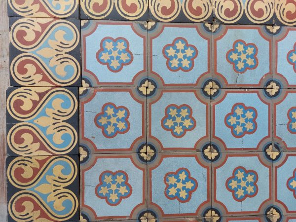 Boch Freres tiles with rich patina and single motif with dominant colors blue and red with matching border tiles