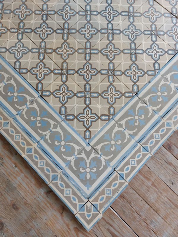 Reclaimend encaustic floor with geometric pattern and double border