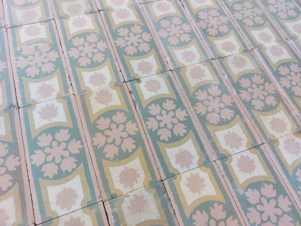 Antique border tiles with floral motif and pink as dominant color