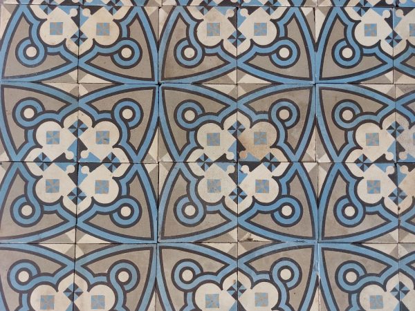 Reclaimed encaustic French tiles with blue and grey as dominat colors