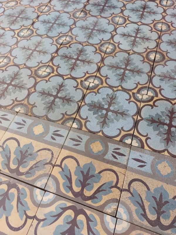 reclaimed encaustic Art-nouveau floor tiles with dominant colors yellow and green and original borders