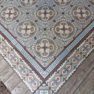 Reclaimed encaustic floor with original border tiles