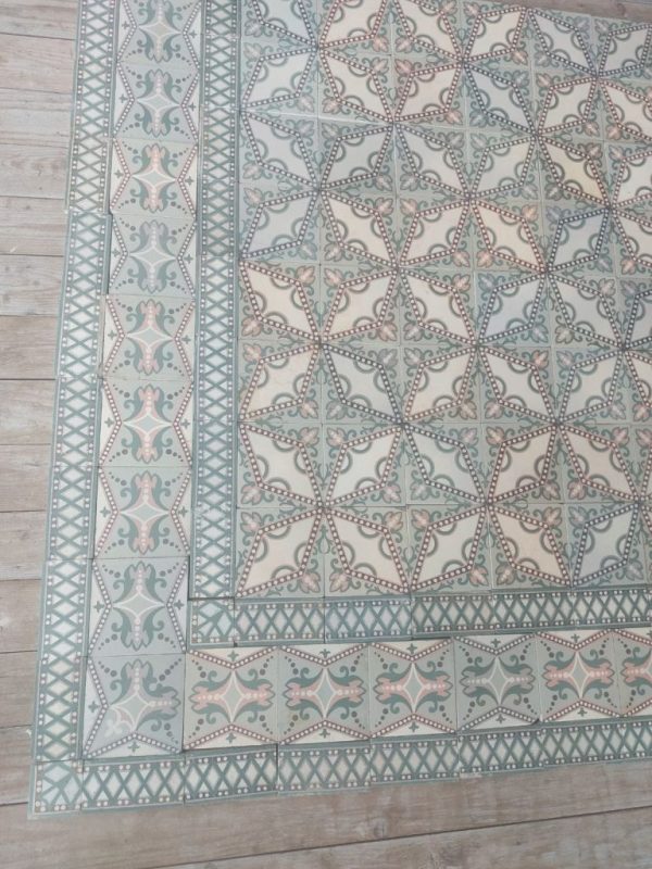 Reclaimed encaustic floor with dotted star pattern and original triple border