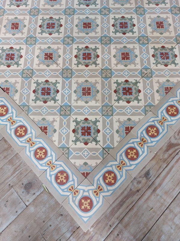 Encaustic reclaimed tiles in a cool color palette with dominante colors blue and grey and single border
