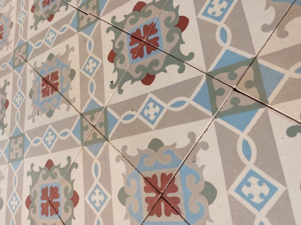 Encaustic reclaimed floor with geometrical and floral motif
