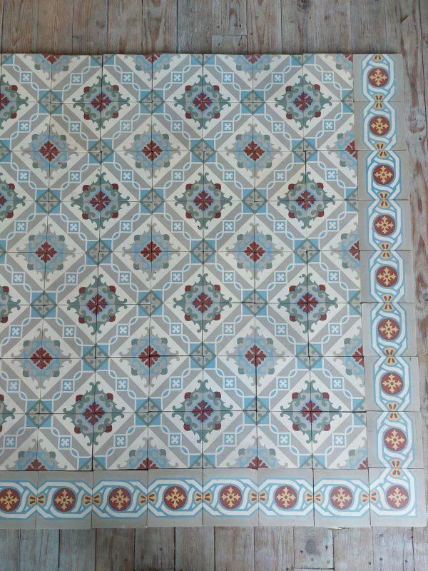 Encaustic reclaimed floor tiles in a cool color palette with dominante colors blue and grey and single border