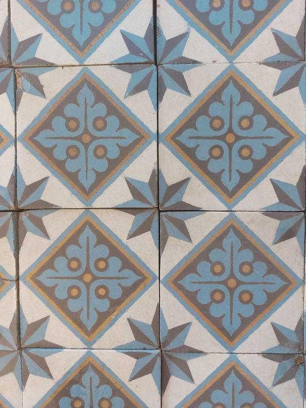 Reclaimed hand made tiles in a cool color palette with blue, white and gold as dominant colors