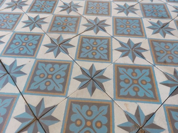 Reclaimed floor tiles in a cool color palette with blue, white and gold as dominant colors