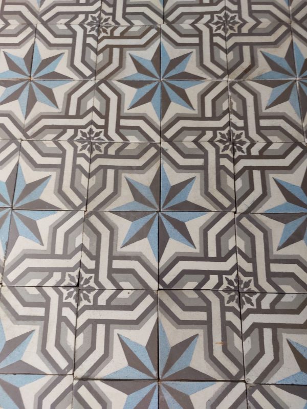 Old reclaimed patterned tiles in a cool color palette of blues and greys (ca 1895)