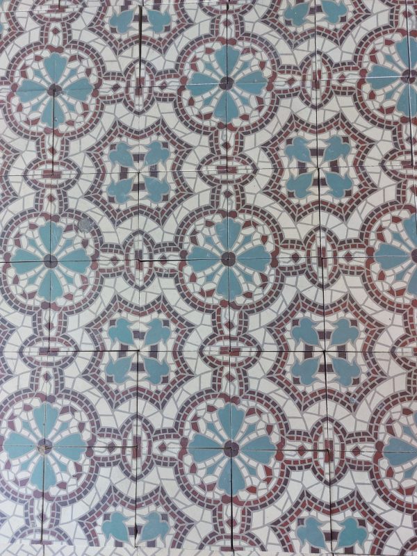 reclaimed encaustic mosaic tiles with flower theme in a cool color palette