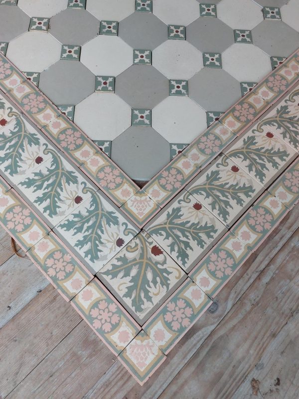 Reclaimed encaustic octagon ceramic floor tiles with cabochons and border tiles with thistle pattern.