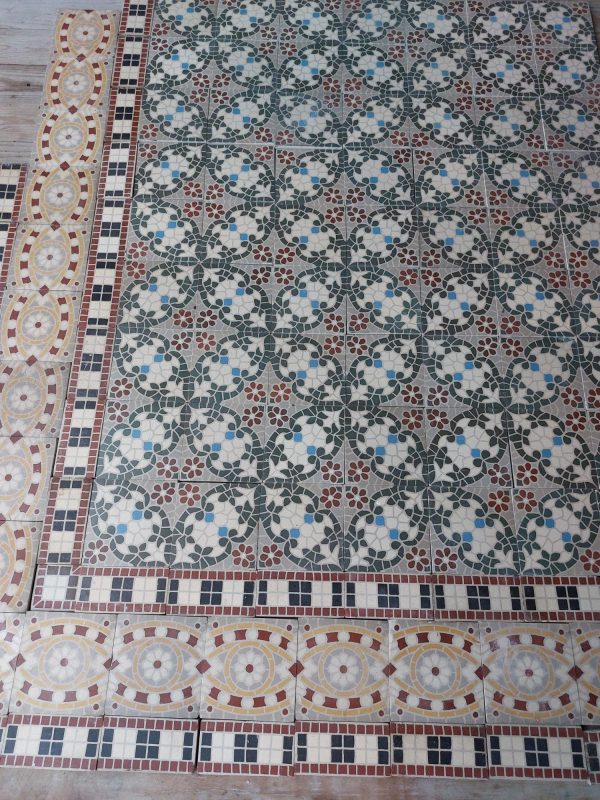 Reclaimed encaustic mosaic floor tiles with floral pattern and triple border