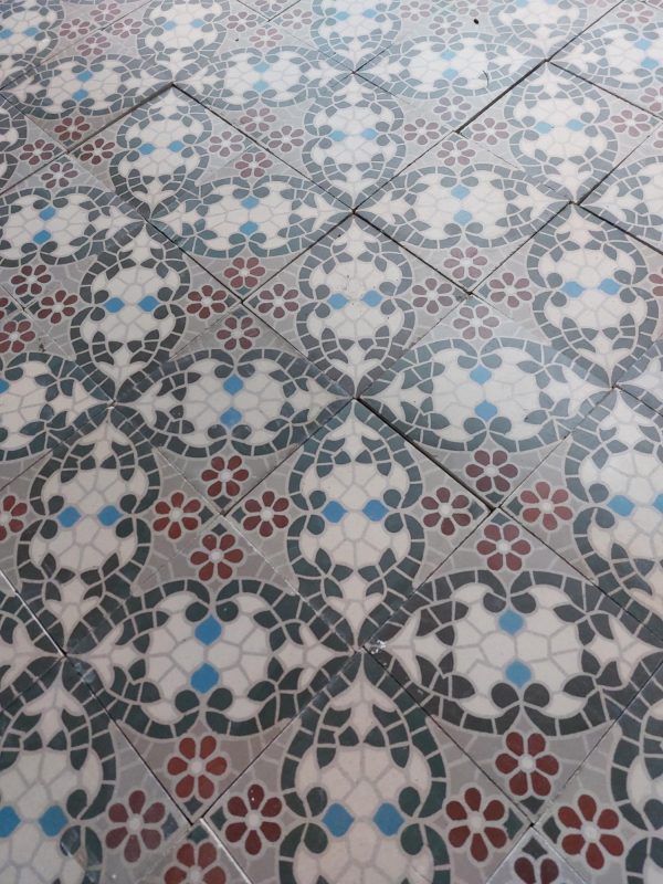 Reclaimed encaustic mosaic floor tiles with flower pattern