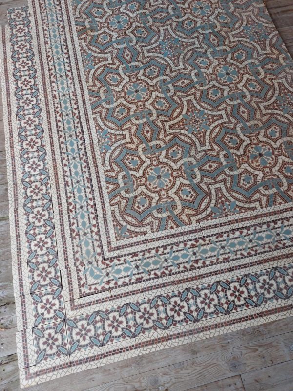 Antique mosaic reclaimed flower themed floor tiles from 1900 with matching borders