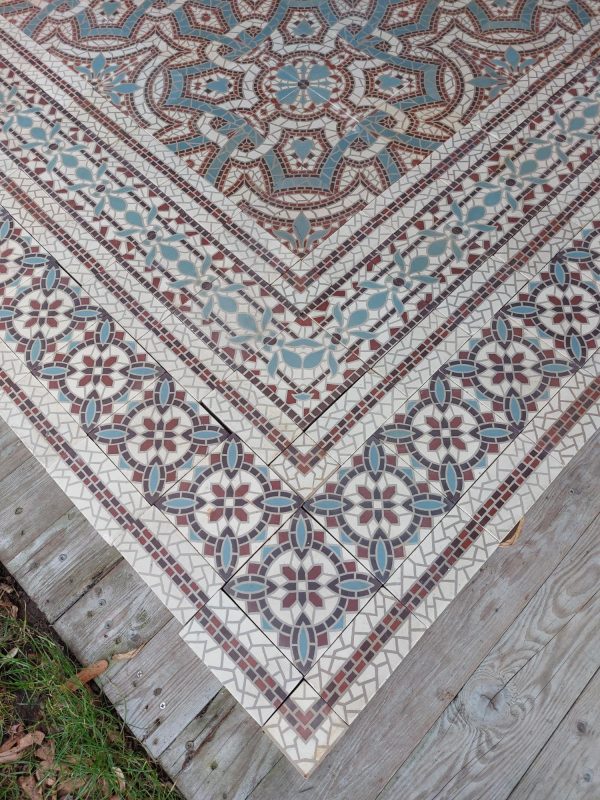 Antique mosaic encaustic flower themed floor tiles from 1900 with matching borders
