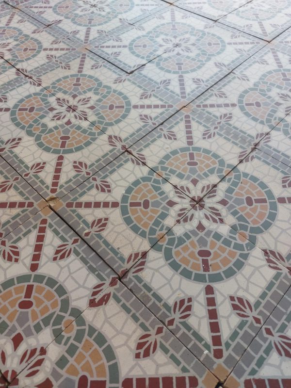 Old false mosaic floor with white and red as dominant colors ca 1920's