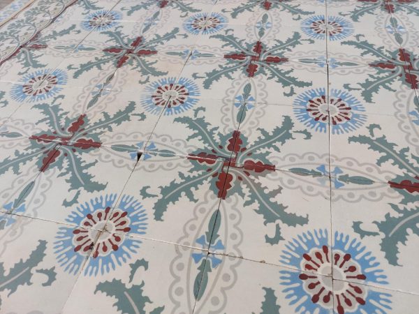 Reclaimed encaustic patterned tiles with flower motif
