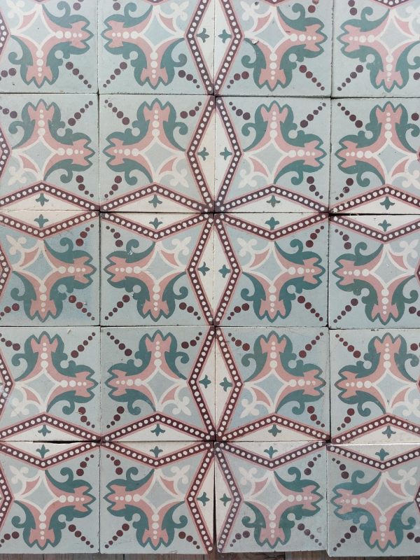 Antique reclaimed tiles with a star pattern in a color palette soft green and pink