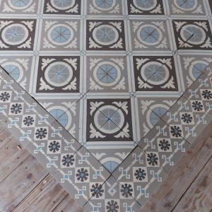 Antique ceramic tiles with original border tiles ca 1895 in different shades of grey with blue