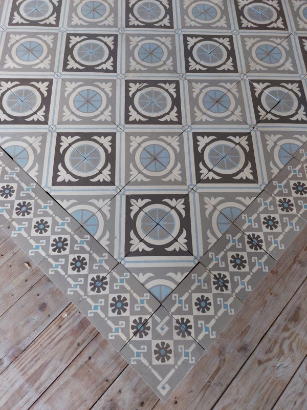 Antique ceramic tiles with original border tiles ca 1895 in different shades of grey with blue