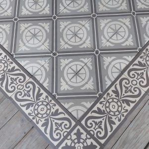 Antique reclaimed ceramic floor with matching borders