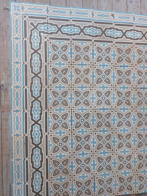 Reclaimed ceramic floor tiles with original double border in blue and grey