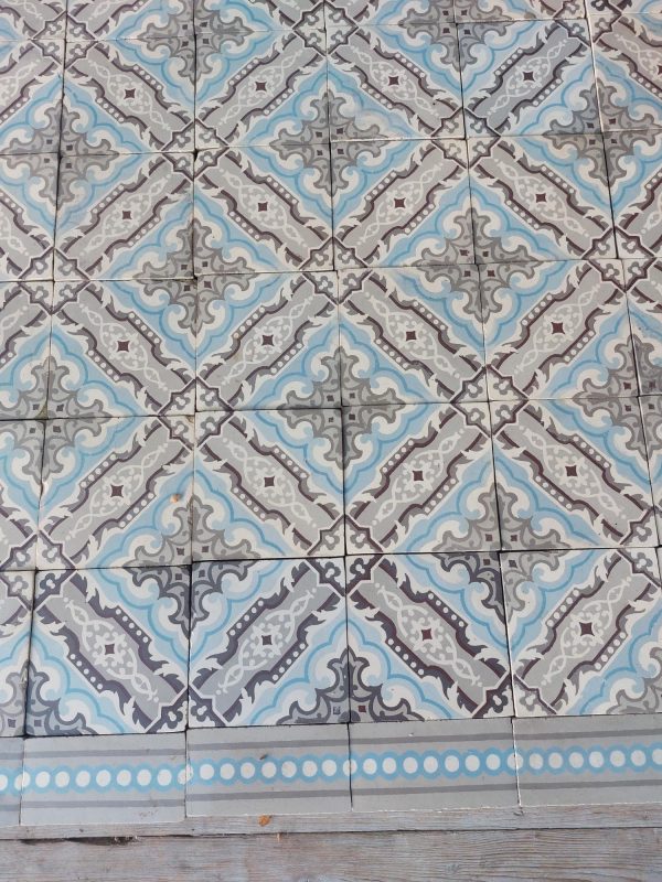 Antique encaustic floortiles with ice blue and different shades of grey