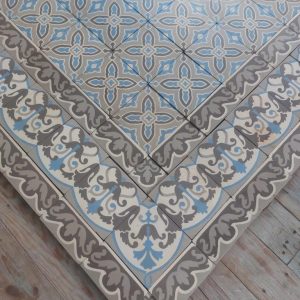 Antique ceramic floor with triple border in shades grey and blue